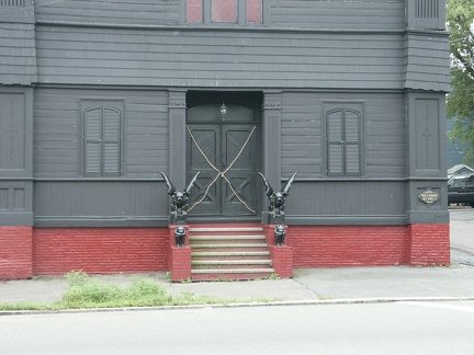 ...and here, it is the little sign on the right of the building